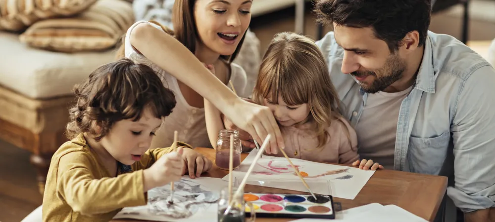 Family painting together in a pest-free home