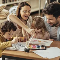 Family painting together in a pest-free home